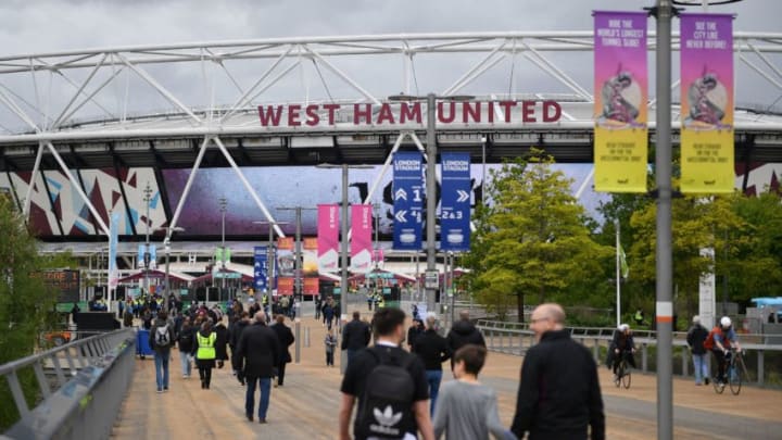 Supporters arrive for the English Premier League football match between West Ham United and Southampton at The London Stadium, in east London on May 23, 2021. (Photo by JUSTIN TALLIS / AFP) (Photo by JUSTIN TALLIS/AFP via Getty Images)