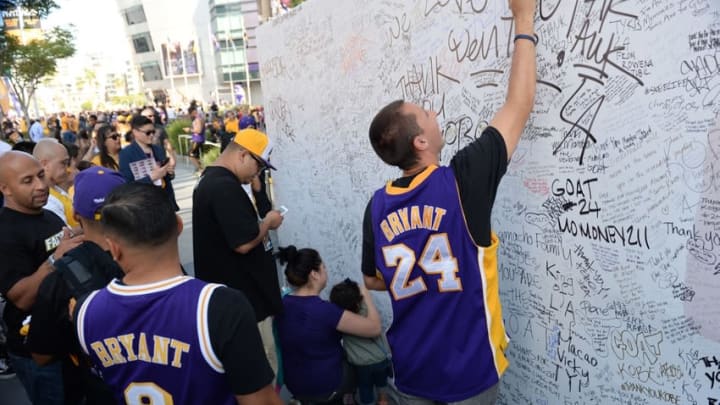 Apr 13, 2016; Los Angeles, CA, USA; Fans sign a large greeting card for Kobe Bryant in front of Staples Center. Bryant concludes his 20-year NBA career tonight with the Los Angeles Lakers game against the Utah Jazz. Mandatory Credit: Robert Hanashiro-USA TODAY Sports