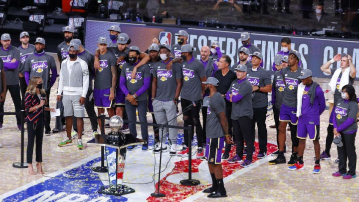 LAKE BUENA VISTA, FLORIDA - SEPTEMBER 26: The Los Angeles Lakers celebrate their win and receive a trophy for Western Conference Champions against Denver Nuggets in Game Five of the Western Conference Finals during the 2020 NBA Playoffs at AdventHealth Arena at the ESPN Wide World Of Sports Complex on September 26, 2020 in Lake Buena Vista, Florida. NOTE TO USER: User expressly acknowledges and agrees that, by downloading and or using this photograph, User is consenting to the terms and conditions of the Getty Images License Agreement. (Photo by Kevin C. Cox/Getty Images)