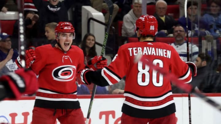 RALEIGH, NC - NOVEMBER 21: Micheal Ferland #79 of the Carolina Hurricanes celebrates with teammate Teuvo Tervainen #86 after scoring a goal during an NHL game against the Toronto Maple Leafs on November 21, 2018 at PNC Arena in Raleigh, North Carolina. (Photo by Gregg Forwerck/NHLI via Getty Images)