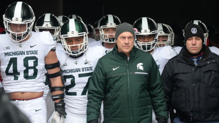 LINCOLN, NE - NOVEMBER 17: Head coach Mark Dantonio of the Michigan State Spartans walks on the field with the team before the game against the Nebraska Cornhuskers at Memorial Stadium on November 17, 2018 in Lincoln, Nebraska. (Photo by Steven Branscombe/Getty Images)