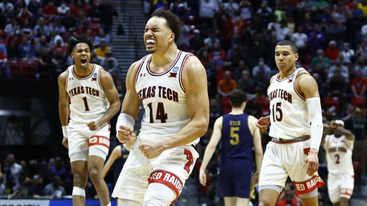 SAN DIEGO, CALIFORNIA – MARCH 20: (L-R) Terrence Shannon Jr. #1, Marcus Santos-Silva #14 and Kevin McCullar #15 of the Texas Tech Red Raiders celebrate during the second half against the Notre Dame Fighting Irish in the second round game of the 2022 NCAA Men’s Basketball Tournament at Viejas Arena at San Diego State University on March 20, 2022 in San Diego, California. (Photo by Ronald Martinez/Getty Images)