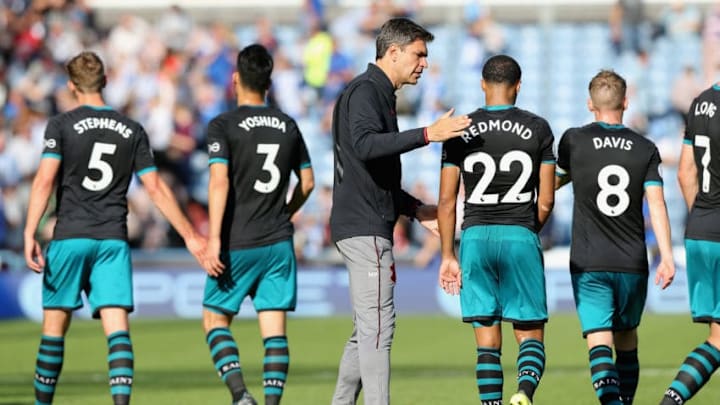 HUDDERSFIELD, ENGLAND - AUGUST 26: Mauricio Pellegrino, Manager of Southampton and Nathan Redmond of Southampton embrace after the Premier League match between Huddersfield Town and Southampton at John Smith's Stadium on August 26, 2017 in Huddersfield, England. (Photo by Nigel Roddis/Getty Images)