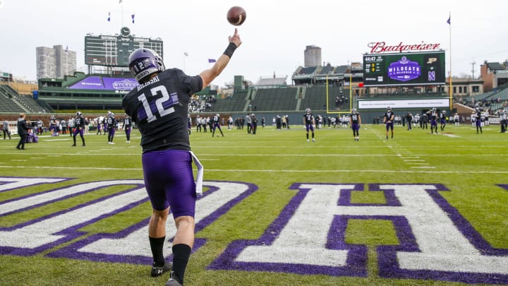 Nov 20, 2021; Chicago, Illinois, USA; Northwestern Wildcats quarterback Ryan Hilinski (12) warms up before the game between the Northwestern Wildcats and the Purdue Boilermakers at Wrigley Field. Mandatory Credit: Jon Durr-USA TODAY Sports