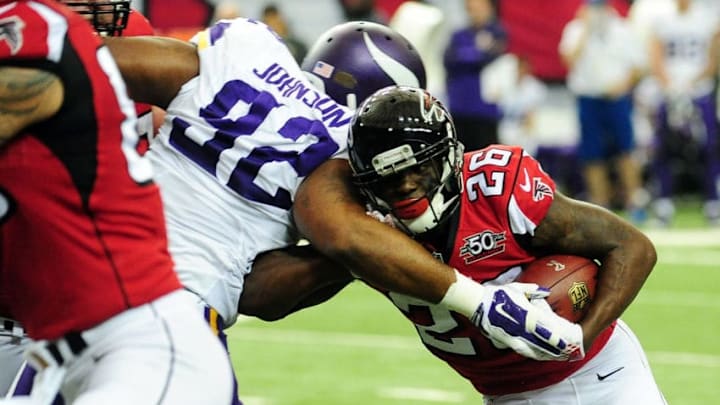 ATLANTA, GA - NOVEMBER 29: Tevin Coleman #26 of the Atlanta Falcons is tackled by Tom Johnson #92 of the Minnesota Vikings during the first half at the Georgia Dome on November 29, 2015 in Atlanta, Georgia. (Photo by Scott Cunningham/Getty Images)