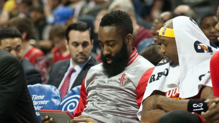 Apr 13, 2015; Charlotte, NC, USA; Houston Rockets guard James Harden (13) and guard Jason Terry (31) looks at a tablet while on the bench during the first half against the Charlotte Hornets at Time Warner Cable Arena. Mandatory Credit: Jeremy Brevard-USA TODAY Sports