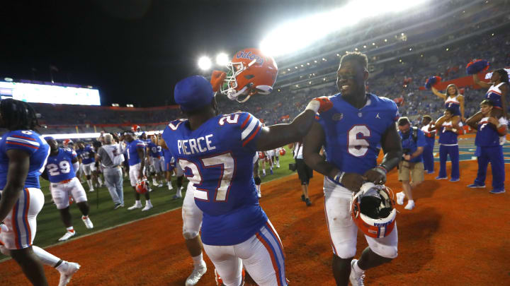 Sep 25, 2021; Gainesville, Florida, USA; Florida Gators defensive lineman Zachary Carter (6) and Florida Gators running back Dameon Pierce (27) celebrate as they beat the Tennessee Volunteers at Ben Hill Griffin Stadium. Mandatory Credit: Kim Klement-USA TODAY Sports