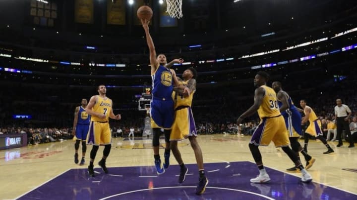Nov 4, 2016; Los Angeles, CA, USA; Golden State Warriors guard Stephen Curry (30) attempts a shot defended by Los Angeles Lakers forward Brandon Ingram (14) during the fourth quarter at Staples Center. The Los Angeles Lakers won 117-97. Mandatory Credit: Kelvin Kuo-USA TODAY Sports