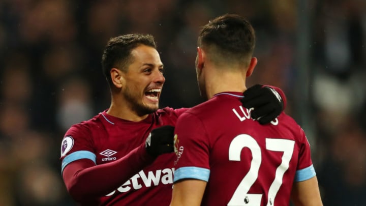 LONDON, ENGLAND - DECEMBER 04: Lucas Perez of West Ham United celebrates with teammate Javier Hernandez after scoring his team's first goal during the Premier League match between West Ham United and Cardiff City at London Stadium on December 4, 2018 in London, United Kingdom. (Photo by Dan Istitene/Getty Images)