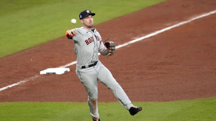 Oct 31, 2021; Atlanta, Georgia, USA; Houston Astros third baseman Alex Bregman (2) throws to first base for the out against the Atlanta Braves during the eighth inning of game five of the 2021 World Series at Truist Park. Mandatory Credit: Dale Zanine-USA TODAY Sports