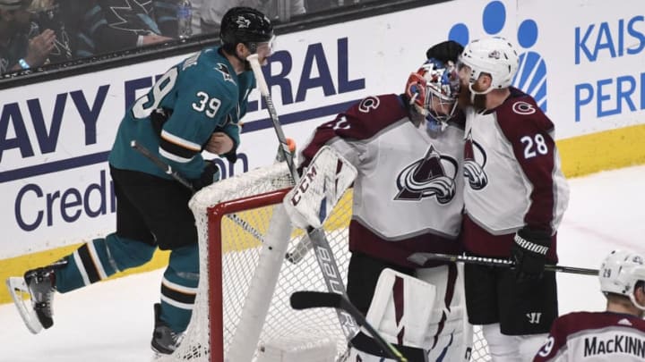 SAN JOSE, CA - APRIL 28: Colorado Avalanche defenseman Ian Cole (28) greets Colorado Avalanche goaltender Philipp Grubauer (31) after defeating San Jose Sharks 4-3 at the SAP Center during the second game of the Stanley Cup Western Conference semifinals April 28, 2019. San Jose Sharks center Logan Couture (39) skates behind the net. (Photo by Andy Cross/MediaNews Group/The Denver Post via Getty Images)