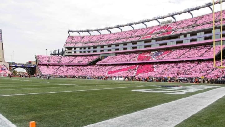Oct 16, 2016; Foxborough, MA, USA; Fans in the stands hold cards in recognition of breast cancer awareness month at the end of the first quarter of the game between the New England Patriots and the Cincinnati Bengals at Gillette Stadium. Mandatory Credit: Stew Milne-USA TODAY Sports
