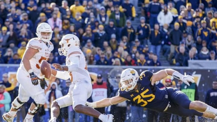 Nov 14, 2015; Morgantown, WV, USA; West Virginia Mountaineers linebacker Nick Kwiatkoski dives for Texas Longhorns quarterback Jerrod Heard during the third quarter at Milan Puskar Stadium. Mandatory Credit: Ben Queen-USA TODAY Sports