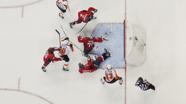 Apr 16, 2016; Washington, DC, USA; Washington Capitals goalie Braden Holtby (70) makes a save on Philadelphia Flyers right wing Wayne Simmonds (17) in the first period in game two of the first round of the 2016 Stanley Cup Playoffs at Verizon Center. The Capitals won 4-1, and lead the series 2-0. Mandatory Credit: Geoff Burke-USA TODAY Sports