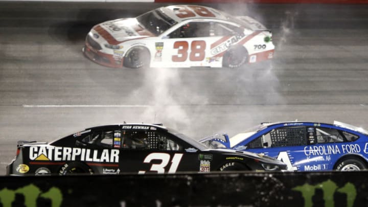 DARLINGTON, SC - SEPTEMBER 02: David Ragan, Front Row Motorsports, Ford Fusion Citgard 700 (38) pass the wrecked cars of Ryan Newman, Richard Childress Racing, Chevrolet Camaro Caterpillar (31) and Clint Bowyer, Stewart-Haas Racing, Ford Fusion Carolina Ford Dealers (14) during the running of the 69th annual Bojangles Southern 500 on Sunday September 2, 2018 at Darlington Raceway in Darlington South Carolina (Photo by Jeff Robinson/Icon Sportswire via Getty Images)