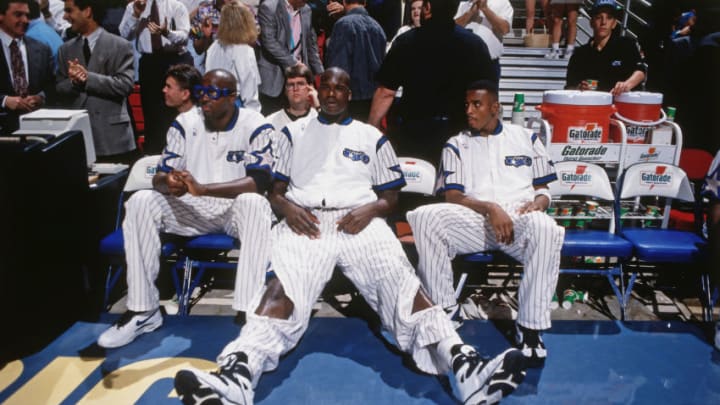 ORLANDO, FL - DECEMBER 14: Horace Grant #54, Shaquille O'Neal #32 and Anfernee Hardaway #1 of the Orlando Magic looks on against the Denver Nuggets on December 14, 1994 at the Orlando Arena in Orlando, Florida. NOTE TO USER: User expressly acknowledges and agrees that, by downloading and or using this photograph, User is consenting to the terms and conditions of the Getty Images License Agreement. Mandatory Copyright Notice: Copyright 1994 NBAE (Photo by Barry Gossage/NBAE via Getty Images)