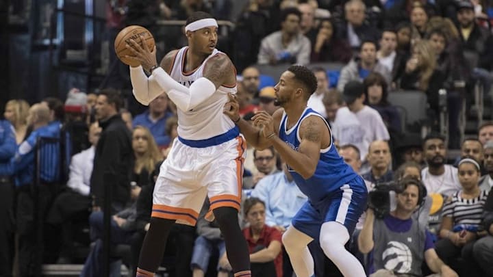 Nov 12, 2016; Toronto, Ontario, CAN; New York Knicks forward Carmelo Anthony (7) controls the ball as Toronto Raptors guard Norman Powell (24) defends during the third quarter in a game Knicks at Air Canada Centre. The Toronto Raptors won 118-107. Mandatory Credit: Nick Turchiaro-USA TODAY Sports