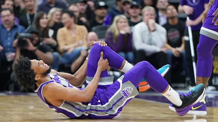 SACRAMENTO, CA - FEBRUARY 27: Marvin Bagley III #35 of the Sacramento Kings falls to the floor holding his left knee after getting hurt against the Milwaukee Bucks during the second half of an NBA basketball game at Golden 1 Center on February 27, 2019 in Sacramento, California. NOTE TO USER: User expressly acknowledges and agrees that, by downloading and or using this photograph, User is consenting to the terms and conditions of the Getty Images License Agreement. (Photo by Thearon W. Henderson/Getty Images)
