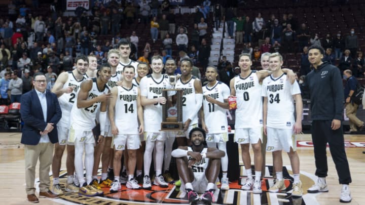 Nov 21, 2021; Uncasville, CT, USA; The Purdue Boilermakes pose with the Hall of Fame Tip Off Tournament Trophy after the game against the Villanova Wildcats at Mohegan Sun Arena. Mandatory Credit: Gregory Fisher-USA TODAY Sports
