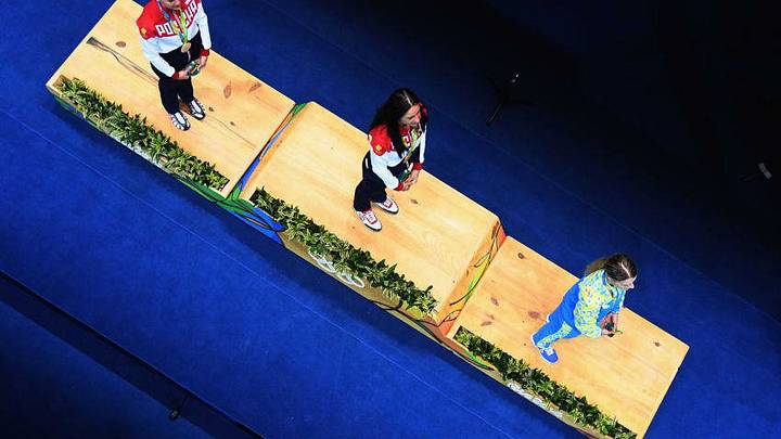 RIO DE JANEIRO, BRAZIL - AUGUST 08: (L-R) Silver medalist Sofya Velikaya of Russia, gold medalist Yana Egorian of Russia and bronze medalist Olga Kharlan of Ukraine pose on the podium during the medal ceremony for the Women's Individual Sabre on Day 3 of the Rio 2016 Olympic Games at Carioca Arena 3 on August 8, 2016 in Rio de Janeiro, Brazil. (Photo by Dean Mouhtaropoulos/Getty Images) RIO DE JANEIRO, BRAZIL - AUGUST 08: (L-R) Silver medalist Sofya Velikaya of Russia, gold medalist Yana Egorian of Russia and bronze medalist Olga Kharlan of Ukraine pose on the podium during the medal ceremony for the Women's Individual Sabre on Day 3 of the Rio 2016 Olympic Games at Carioca Arena 3 on August 8, 2016 in Rio de Janeiro, Brazil. (Photo by Dean Mouhtaropoulos/Getty Images)