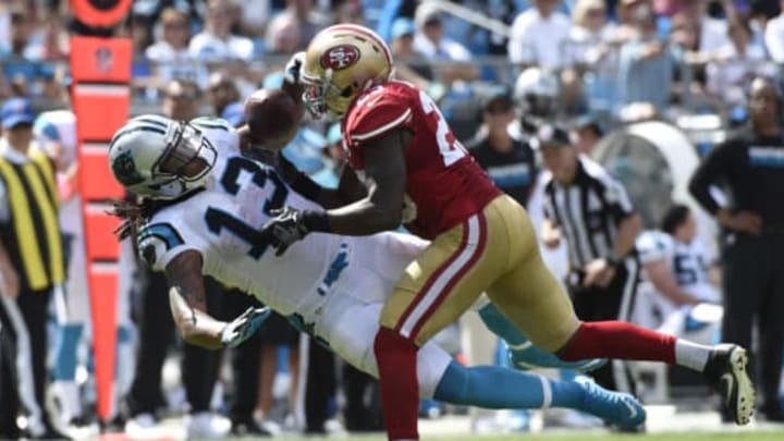 Sep 18, 2016; Charlotte, NC, USA; Carolina Panthers wide receiver Kelvin Benjamin (13) catches the ball as San Francisco 49ers cornerback Jimmie Ward (25) defends in the third quarter. The Panthers defeated the 49ers 46-27 at Bank of America Stadium. Mandatory Credit: Bob Donnan-USA TODAY Sports