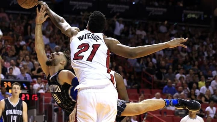 Mar 25, 2016; Miami, FL, USA; Miami Heat center Hassan Whiteside (21) blocks a shot by Orlando Magic guard Evan Fournier (10) in the first half at American Airlines Arena. Mandatory Credit: Robert Mayer-USA TODAY Sports