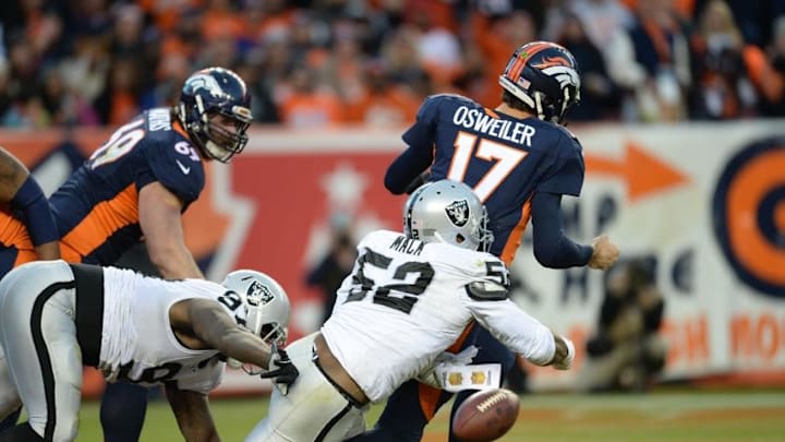 Dec 13, 2015; Denver, CO, USA; Oakland Raiders defensive end Khalil Mack (52) sacks Denver Broncos quarterback Brock Osweiler (17) in end zone during the third quarter at Sports Authority Field at Mile High. Mandatory Credit: Ron Chenoy-USA TODAY Sports