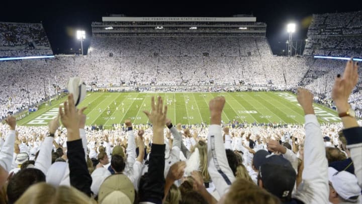 STATE COLLEGE, PA - OCTOBER 21: Fans cheer in the stands on the 50-yard-line as Saquon Barkley scores a first quarter touchdown during the whole stadium white out. The Penn State Nittany Lions vs. the Michigan Wolverines on October 21, 2017 at Beaver Stadium in State College, PA. (Photo by Randy Litzinger/Icon Sportswire via Getty Images)