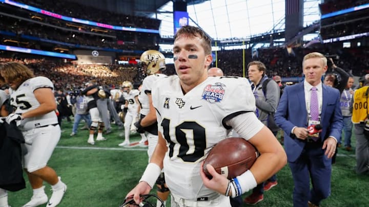 ATLANTA, GA - JANUARY 01: McKenzie Milton #10 of the UCF Knights reacts after defeating the Auburn Tigers 34-27 to win the Chick-fil-A Peach Bowl at Mercedes-Benz Stadium on January 1, 2018 in Atlanta, Georgia. (Photo by Kevin C. Cox/Getty Images)