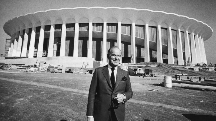 FILE - In this Nov. 6, 1967, file photo, multi-millionaire Jack Kent Cooke poses outside The Forum in Inglewood, Calif. It is the sports palace he's b