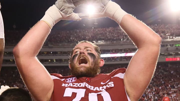 Oct 15, 2016; Fayetteville, AR, USA; Arkansas Razorbacks offensive lineman Dan Skipper (70) celebrates with teammates after the game against the Ole Miss Rebels at Donald W. Reynolds Razorback Stadium. Arkansas defeated Ole Miss 34-30. Mandatory Credit: Nelson Chenault-USA TODAY Sports