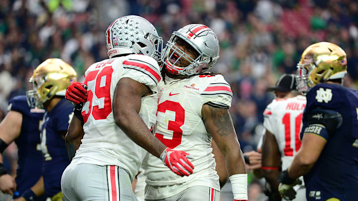 GLENDALE, AZ – JANUARY 01: Defensive lineman Tyquan Lewis #59 of the Ohio State Buckeyes (left) celebrates a fourth quarter sack with defensive lineman Tracy Sprinkle #93 (right) during the fourth quarter of the BattleFrog Fiesta Bowl against the Notre Dame Fighting Irish at University of Phoenix Stadium on January 1, 2016 in Glendale, Arizona. (Photo by Jennifer Stewart/Getty Images)