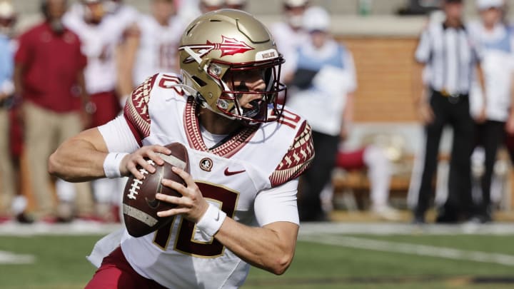 Sep 18, 2021; Winston-Salem, North Carolina, USA; Florida State Seminoles quarterback McKenzie Milton (10) scrambles out of the pocket during the first quarter against the Wake Forest Demon Deacons at Truist Field. Mandatory Credit: Reinhold Matay-USA TODAY Sports