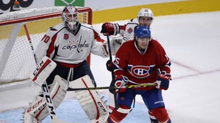 Sep 28, 2014; Montreal, Quebec, CAN; Montreal Canadiens forward Pierre-Alexandre Parenteau (15) screens Washington Capitals goalie Braden Holtby (70) and teammate Brooks Orpik (44) during the third period at the Bell Centre. Mandatory Credit: Eric Bolte-USA TODAY Sports