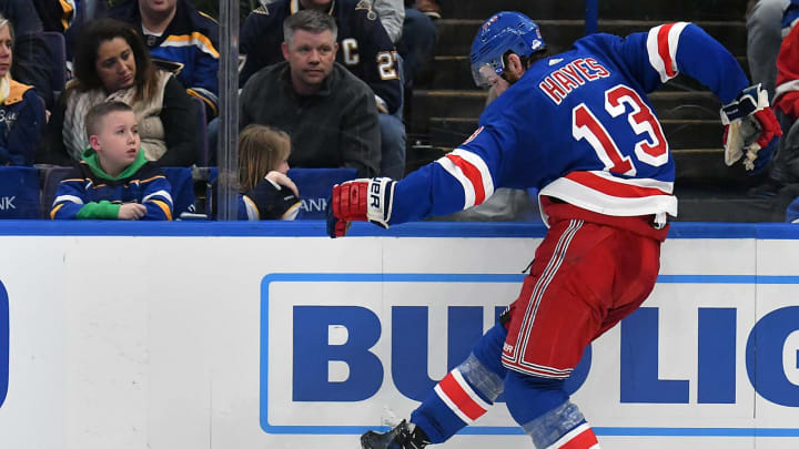 ST. LOUIS, MO – MARCH 17: New York Rangers center Kevin Hayes (13) kicks the puck after losing his stick during a NHL game between the New York Rangers and the St. Louis Blues on March 17, 2018, at Scottrade Center, St. Louis, MO. St. Louis beat New York in overtime, 4-3. (Photo by Keith Gillett/Icon Sportswire via Getty Images).