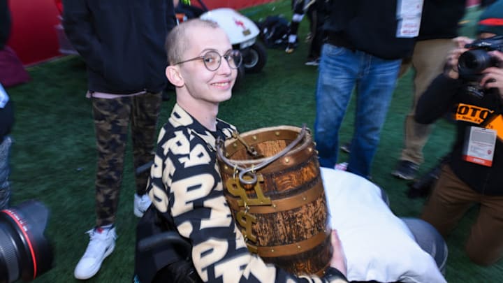 BLOOMINGTON, IN - NOVEMBER 24: Purdue honorary captain Tyler Trent with the Old Oaken Bucket following a college football game between the Purdue Boilermakers and Indiana Hoosiers on November 24, 2018, at Memorial Stadium in Bloomington, IN. (Photo by James Black/Icon Sportswire via Getty Images)