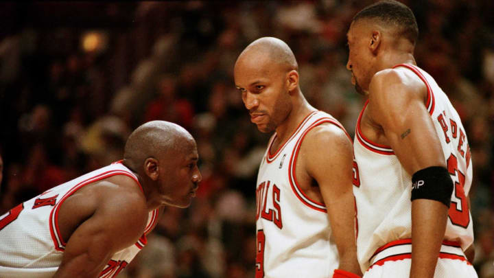 7 Jun 1996: Michael Jordan of the Chicago Bull, left, discusses strategy with teammates Ron Harper, center, and Scottie Pippen during a time-out on the court during the fourth quarter of game two in the NBA Finals at the United Center in Chicago, Illino