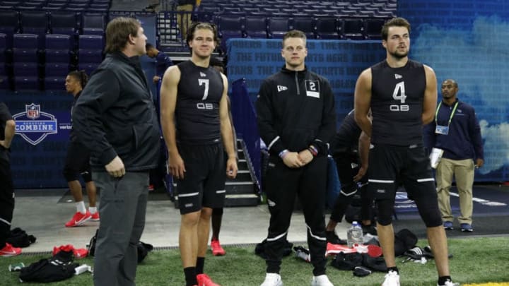 INDIANAPOLIS, IN - FEBRUARY 27: Former NFL quarterback Chad Pennington stands alongside quarterbacks Justin Herbert of Oregon, Joe Burrow of LSU and Jacob Eason of Washington during the NFL Scouting Combine at Lucas Oil Stadium on February 27, 2020 in Indianapolis, Indiana. (Photo by Joe Robbins/Getty Images)