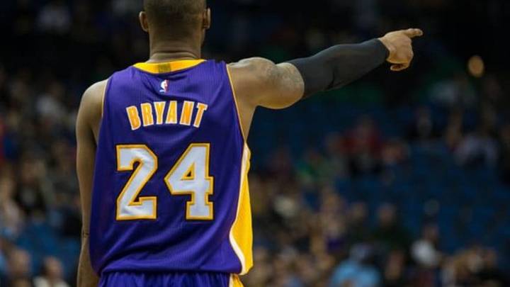 Dec 14, 2014; Minneapolis, MN, USA; Los Angeles Lakers guard Kobe Bryant (24) points during the third quarter against the Minnesota Timberwolves at Target Center. The Lakers defeated the Timberwolves 100-94. Mandatory Credit: Brace Hemmelgarn-USA TODAY Sports