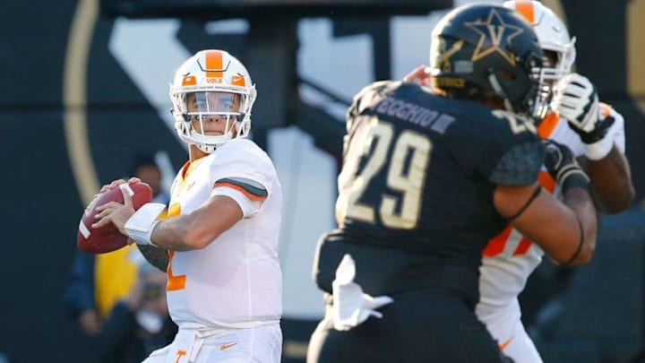 NASHVILLE, TN - NOVEMBER 24: Quarterback Jarrett Guarantano #2 of the Tennessee Volunteers drops back to throw a pass against Louis Vecchio #29 of the Vanderbilt Commodores during the first half at Vanderbilt Stadium on November 24, 2018 in Nashville, Tennessee. (Photo by Frederick Breedon/Getty Images)