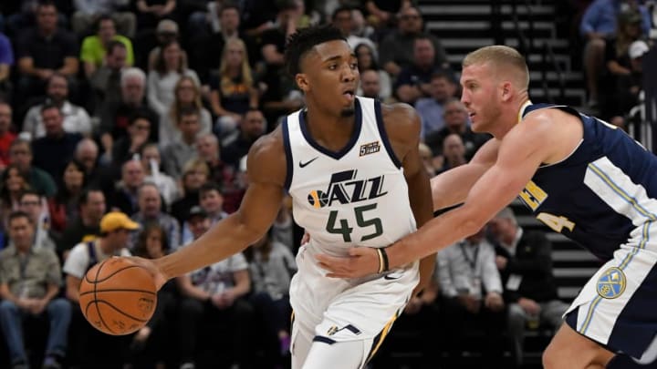 ALT LAKE CITY, UT - OCTOBER 18: Donovan Mitchell #45 of the Utah Jazz controls the ball in the first half while being defended by Mason Plumlee #24 of the Denver Nuggets during his NBA debut at Vivint Smart Home Arena on October 18, 2017 in Salt Lake City, Utah. (Photo by Gene Sweeney Jr./Getty Images)