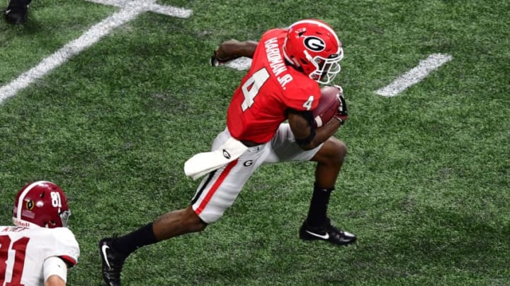 ATLANTA, GA - JANUARY 08: Mecole Hardman #4 of the Georgia Bulldogs carries the ball against the Alabama Crimson Tide in the CFP National Championship presented by AT&T at Mercedes-Benz Stadium on January 8, 2018 in Atlanta, Georgia. (Photo by Scott Cunningham/Getty Images)