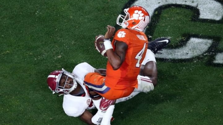 Jan 11, 2016; Glendale, AZ, USA; Alabama Crimson Tide linebacker Rashaan Evans (32) sacks Clemson Tigers quarterback Deshaun Watson (4) during the third quarter in the 2016 CFP National Championship at University of Phoenix Stadium. Mandatory Credit: Erich Schlegel-USA TODAY Sports