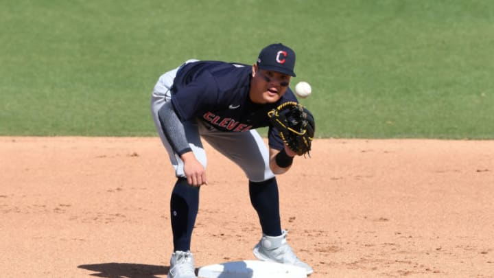 PHOENIX, ARIZONA - MARCH 04: Yu Chang #2 of the Cleveland Indians catches a throw from the catcher against the Milwaukee Brewers during a spring training game at American Family Fields of Phoenix on March 04, 2021 in Phoenix, Arizona. It was Chang's second home run of the game. (Photo by Norm Hall/Getty Images)