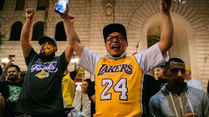 LOS ANGELES, CA - OCTOBER 11: Lakers fans celebrate at an outside bar on October 11, 2020 in Los Angeles, California. People gathered to celebrate after the Los Angeles Lakers defeated the Miami Heat in game 6 of the NBA finals. (Photo by Brandon Bell/Getty Images)