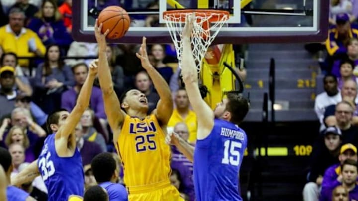 Jan 5, 2016; Baton Rouge, LA, USA; LSU Tigers forward Ben Simmons (25) shoots over Kentucky Wildcats forward Isaac Humphries (15) and forward Derek Willis (35) during the second half of a game at the Pete Maravich Assembly Center. LSU defeated Kentucky 85-67. Mandatory Credit: Derick E. Hingle-USA TODAY Sports