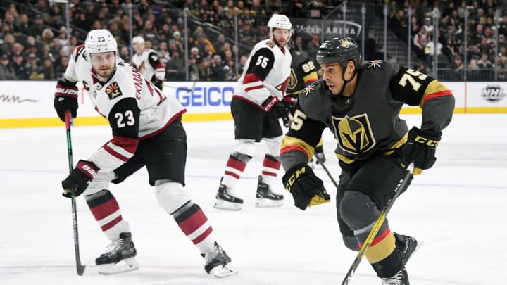 LAS VEGAS, NEVADA – DECEMBER 28: Ryan Reaves #75 of the Vegas Golden Knights skates with the puck against Oliver Ekman-Larsson #23 of the Arizona Coyotes in the second period of their game at T-Mobile Arena on December 28, 2019 in Las Vegas, Nevada. (Photo by Ethan Miller/Getty Images)