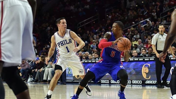 Oct 15, 2016; Philadelphia, PA, USA; Detroit Pistons guard Kentavious Caldwell-Pope (5) looks to pass as Philadelphia 76ers guard T.J. McConnell (1) defends during the second quarter of the preseason game at the Wells Fargo Center. Mandatory Credit: John Geliebter-USA TODAY Sports