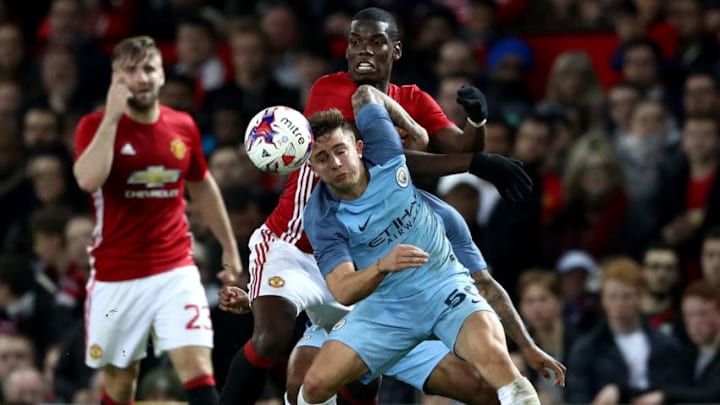 MANCHESTER, ENGLAND - OCTOBER 26: Paul Pogba of Manchester United (C) and Pablo Maffeo of Manchester City (R) battle for possession during the EFL Cup fourth round match between Manchester United and Manchester City at Old Trafford on October 26, 2016 in Manchester, England. (Photo by David Rogers/Getty Images)