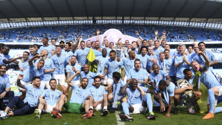 MANCHESTER, ENGLAND - MAY 06: The Manchester City squad celebrate with the Premier League trophy during the Premier League match between Manchester City and Huddersfield Town at Etihad Stadium on May 6, 2018 in Manchester, England. (Photo by Michael Regan/Getty Images)